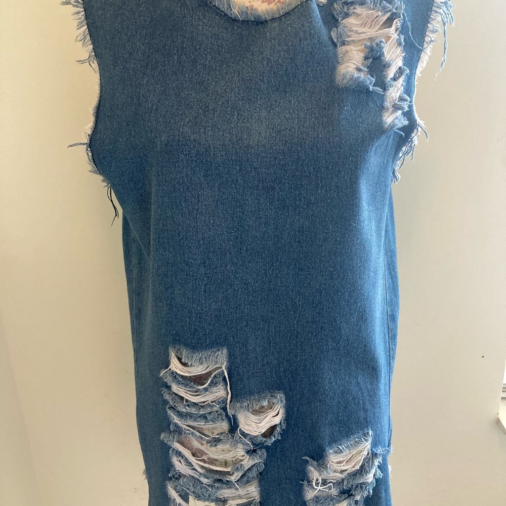 Women’s blue jean top and shoes.